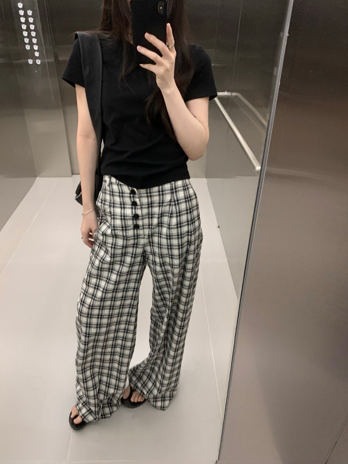 Asymmetric buttoned checkered pants
