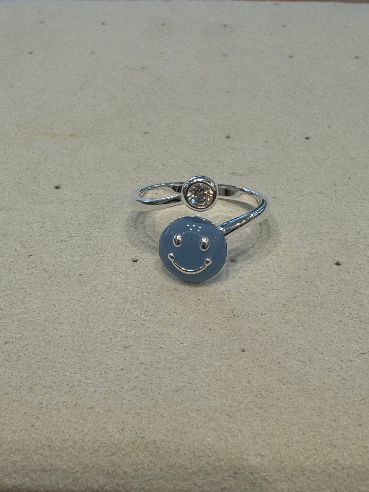 Silver smiling face ring