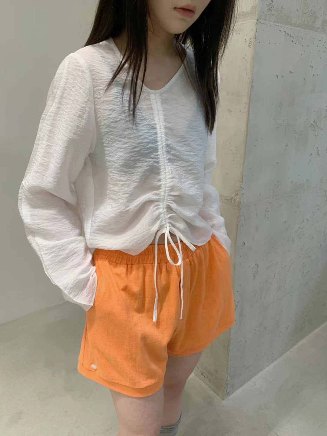 Irregular drawstring collar blouse
